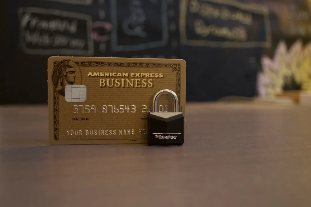 Close-up photo of an American Express business card on a brown surface
