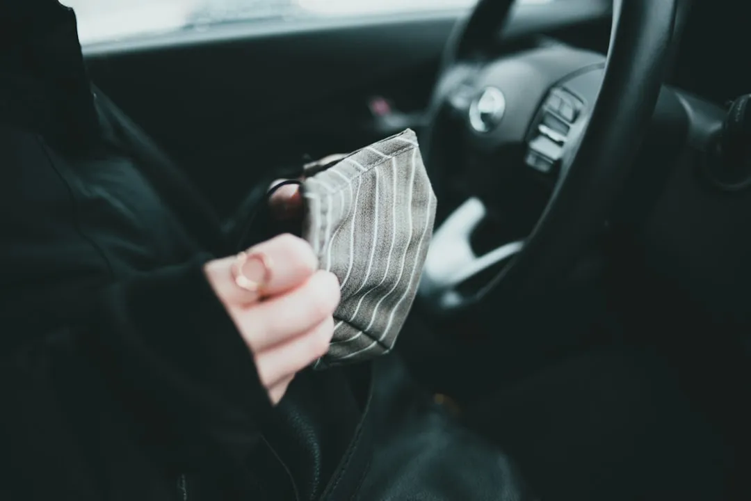 Person holding black and white striped fabric