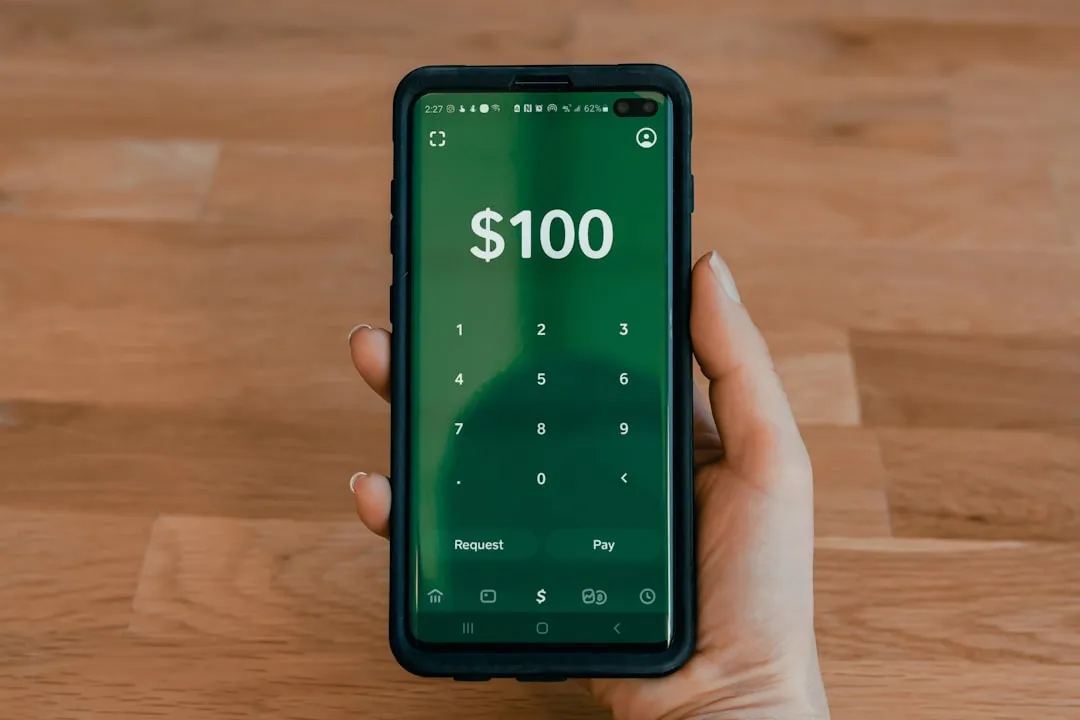 Person holding a black Android smartphone