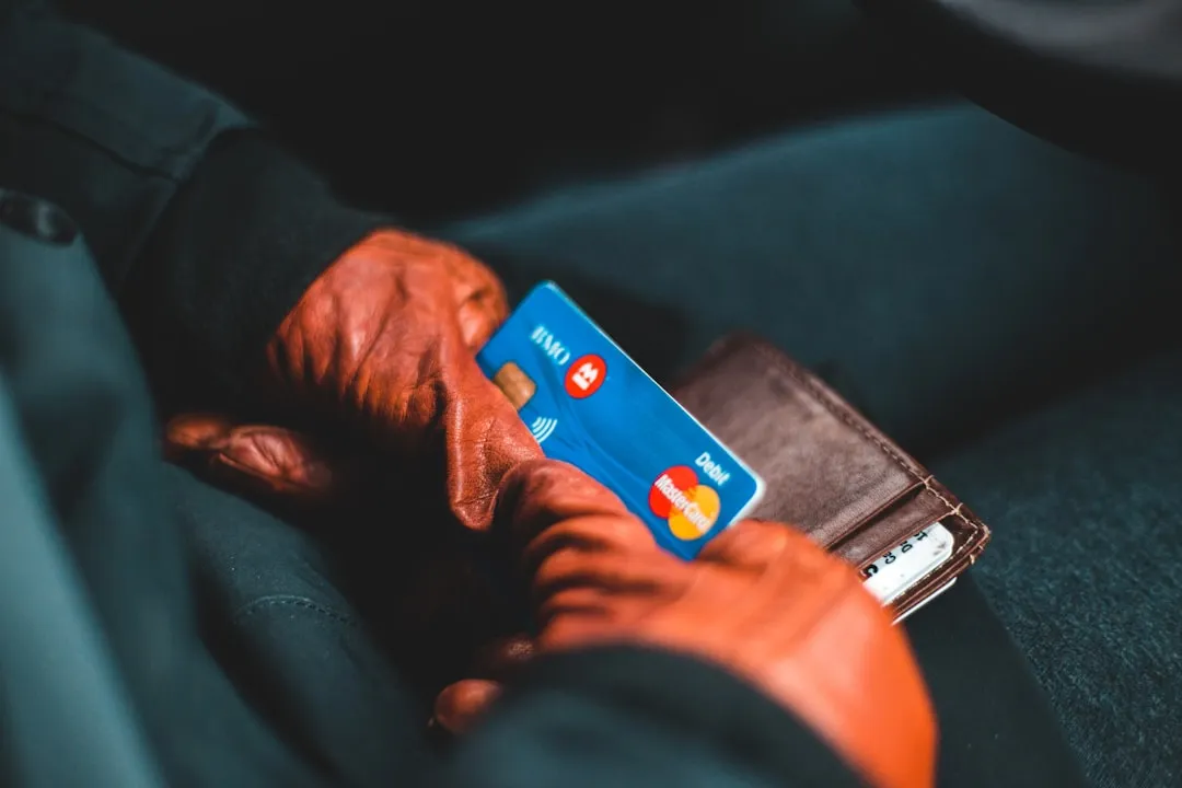 Person holding a blue and white card