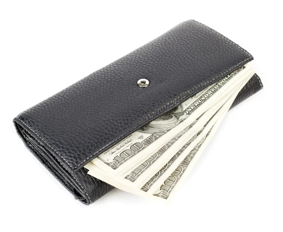 A wallet with money sticking out of it