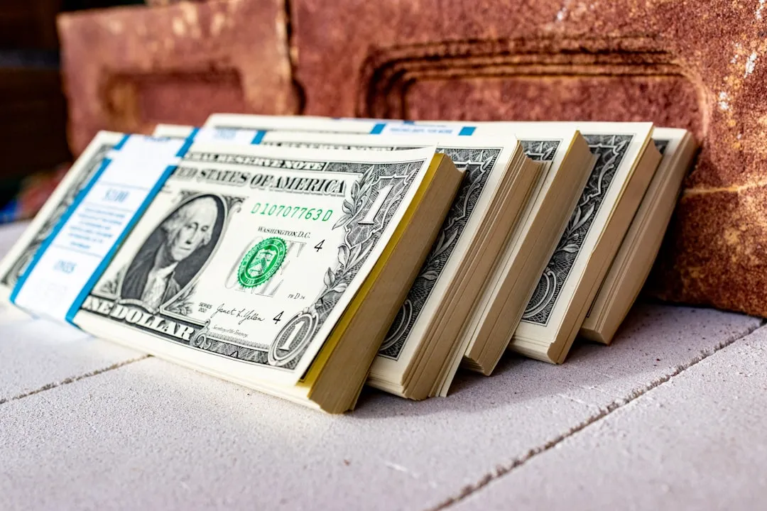 A stack of money on top of a table
