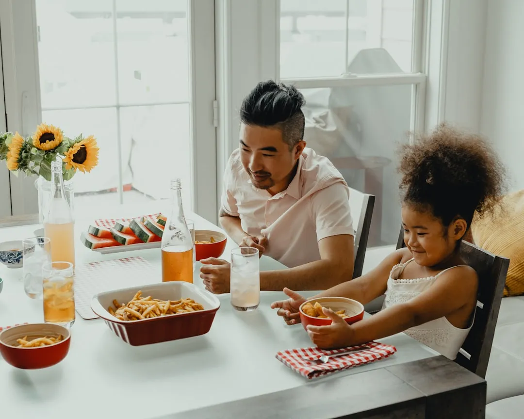 Boy and girl eating at the table