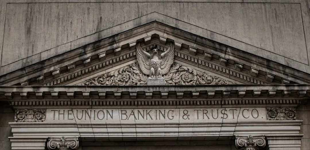Brown concrete building with a statue, symbolizing the solid foundation of smart financial planning.