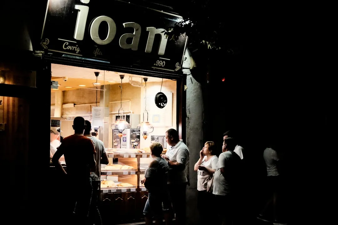 People outside a store during the night People outside a store during the night